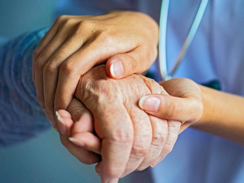 Long Term Care Holding Hand